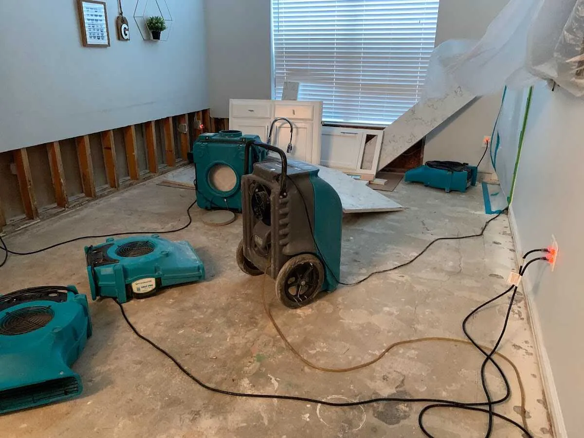 Dehumidifier in flood-cut room for Water Damage Restoration in Heartland